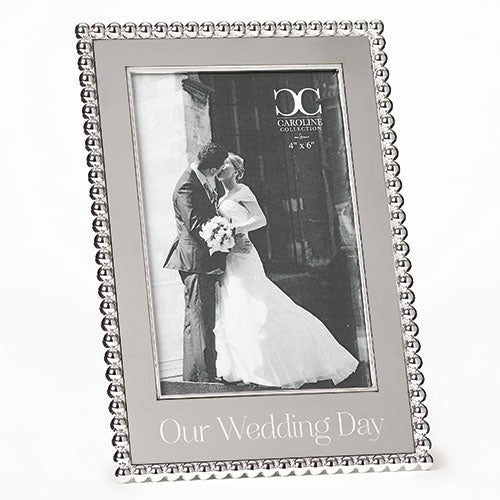 Silver wedding photo frame with beaded border and "Our Wedding Day" inscription, holds 4" x 6" photo.