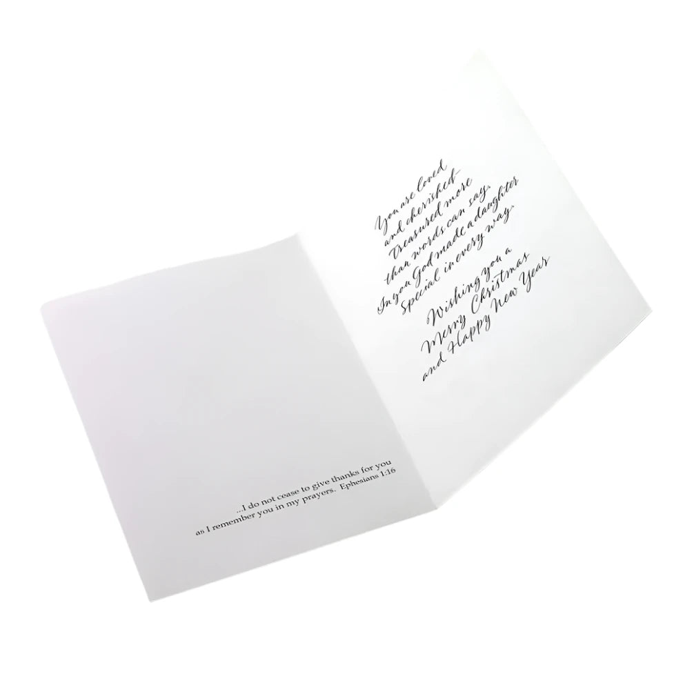 Inside view of Christmas card for daughter with loving message and Bible verse from 1 Timothy 1:16 in elegant script