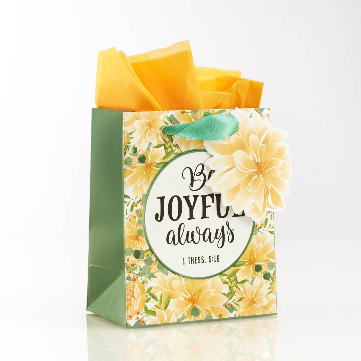 Extra small gift bag with yellow floral design, green handles, and "Be joyful always 1 Thessalonians 5:16" text with tissue paper