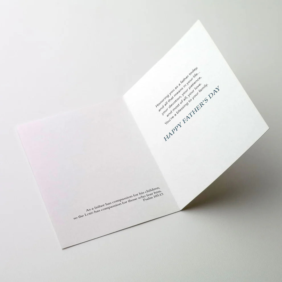 Inside view of God Bless You on Father's Day card with Bible verse and heartfelt message in blue text on white background