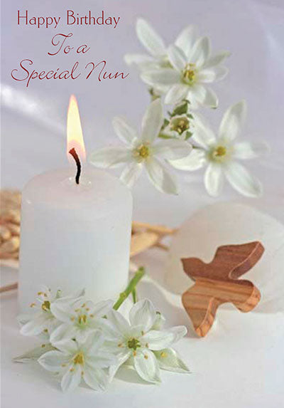 Birthday card for a special nun with white candle, wooden cross, and delicate white flowers on soft background.