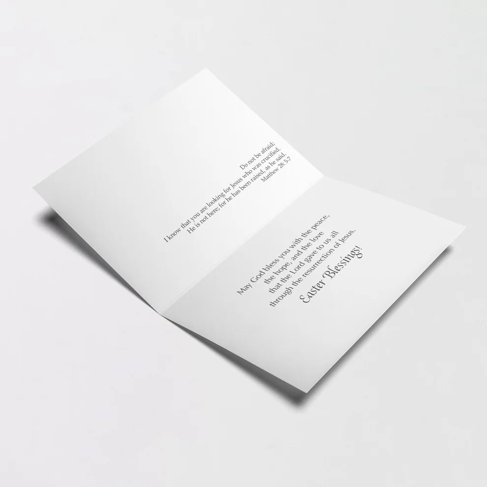 Open Easter greeting card with biblical verse and blessings printed on white interior pages