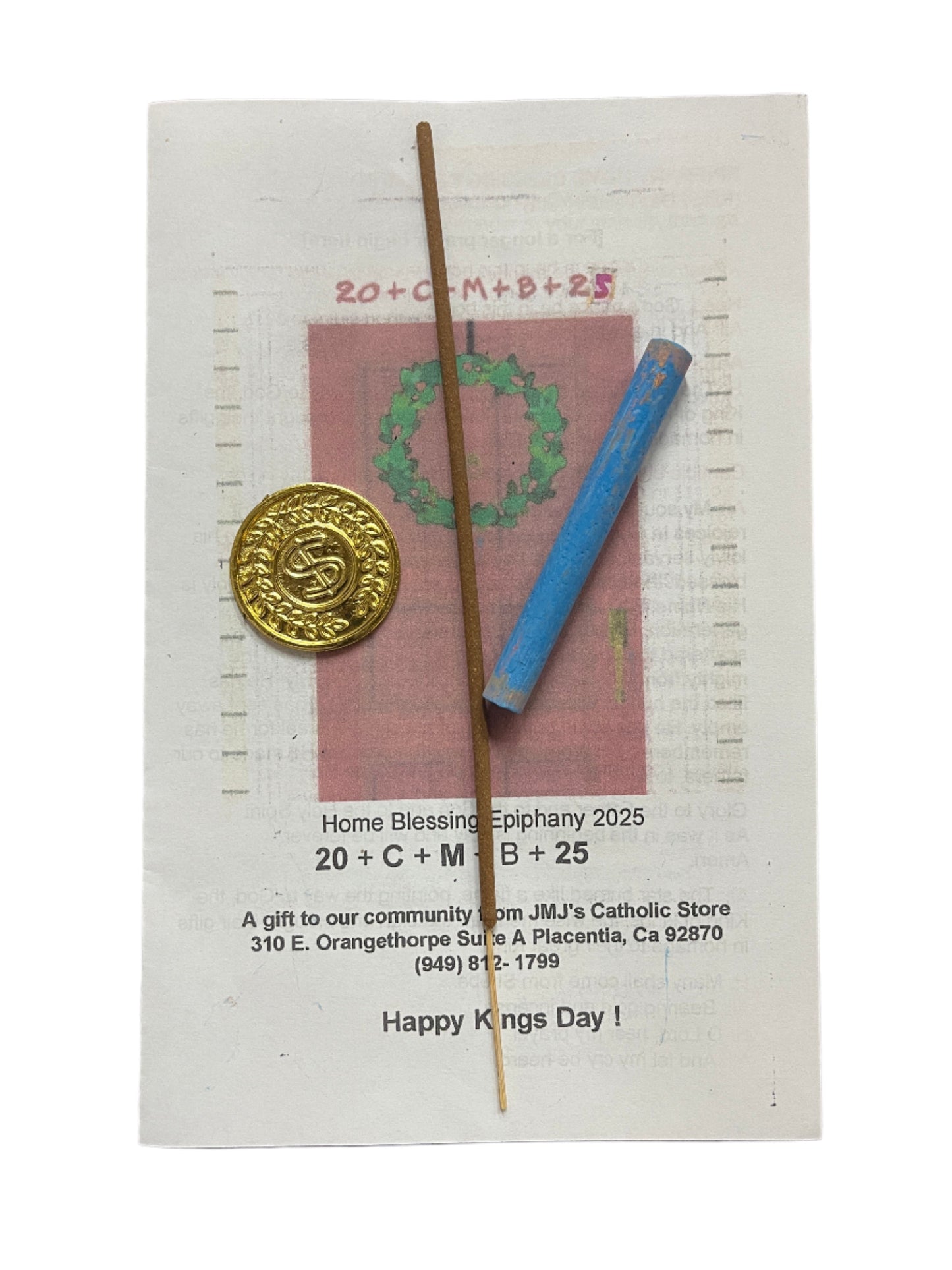 Gold Saint Benedict medal with detailed design, wooden incense stick, and blue prayer candle on prayer card.