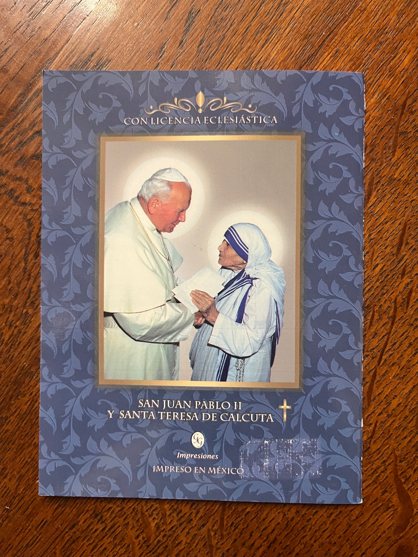 Novena to Saint Teresa of Calcutta book with image of Pope John Paul II and Mother Teresa on floral background