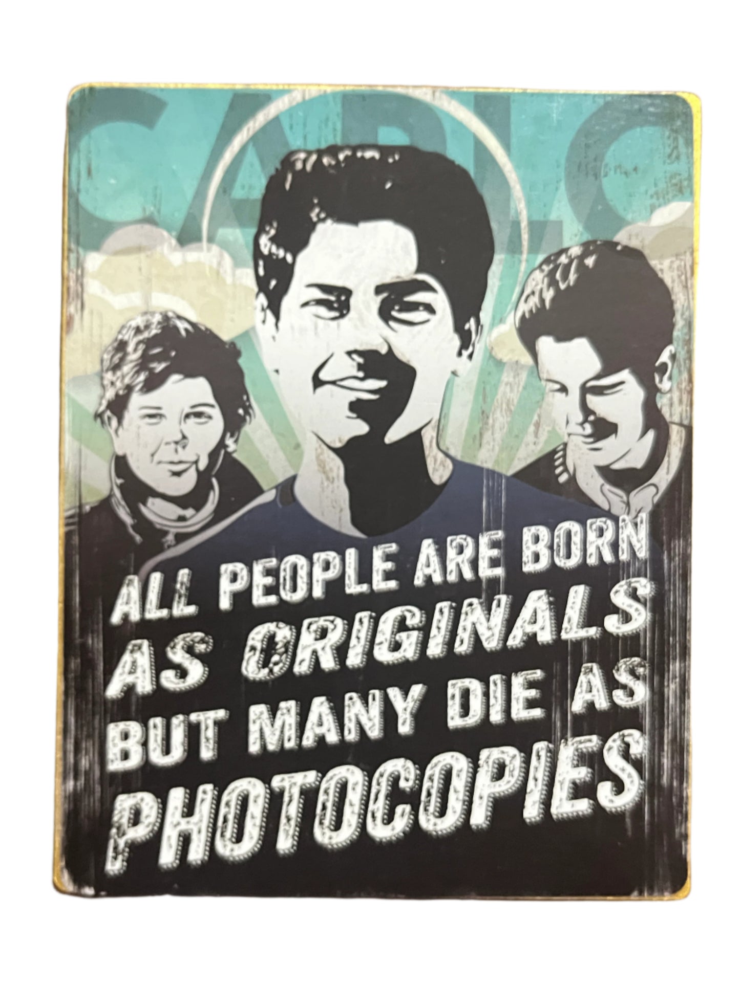 4.5" wooden block with black and white portraits of Carlo Acutis and quote on originality against blue background