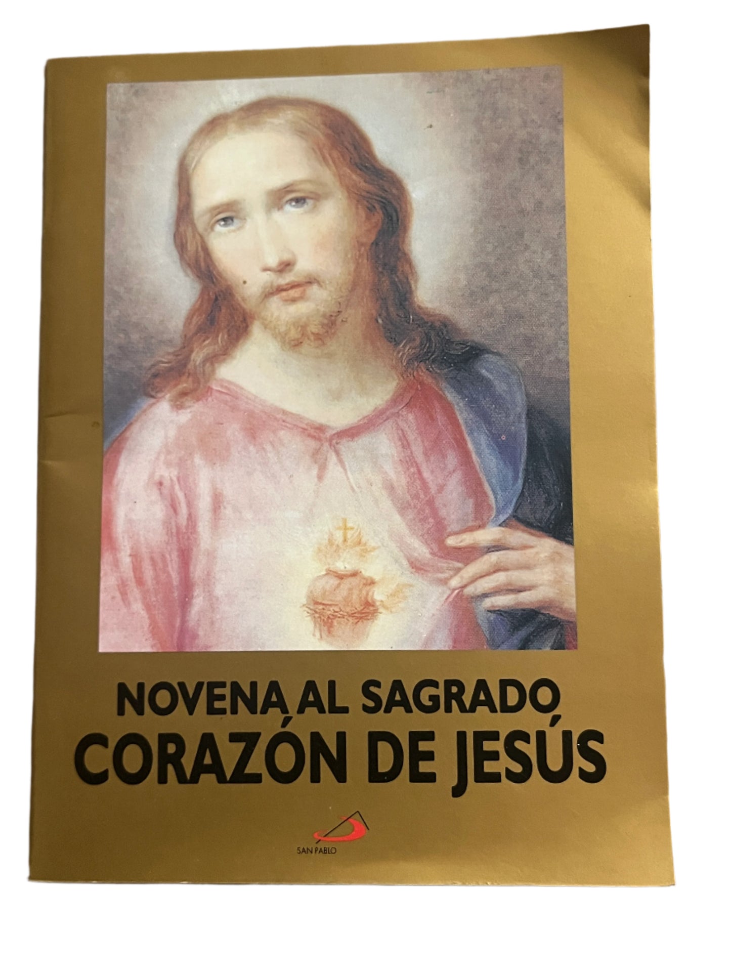 Novena prayer booklet featuring the Sacred Heart of Jesus image with devotional text on gold background cover