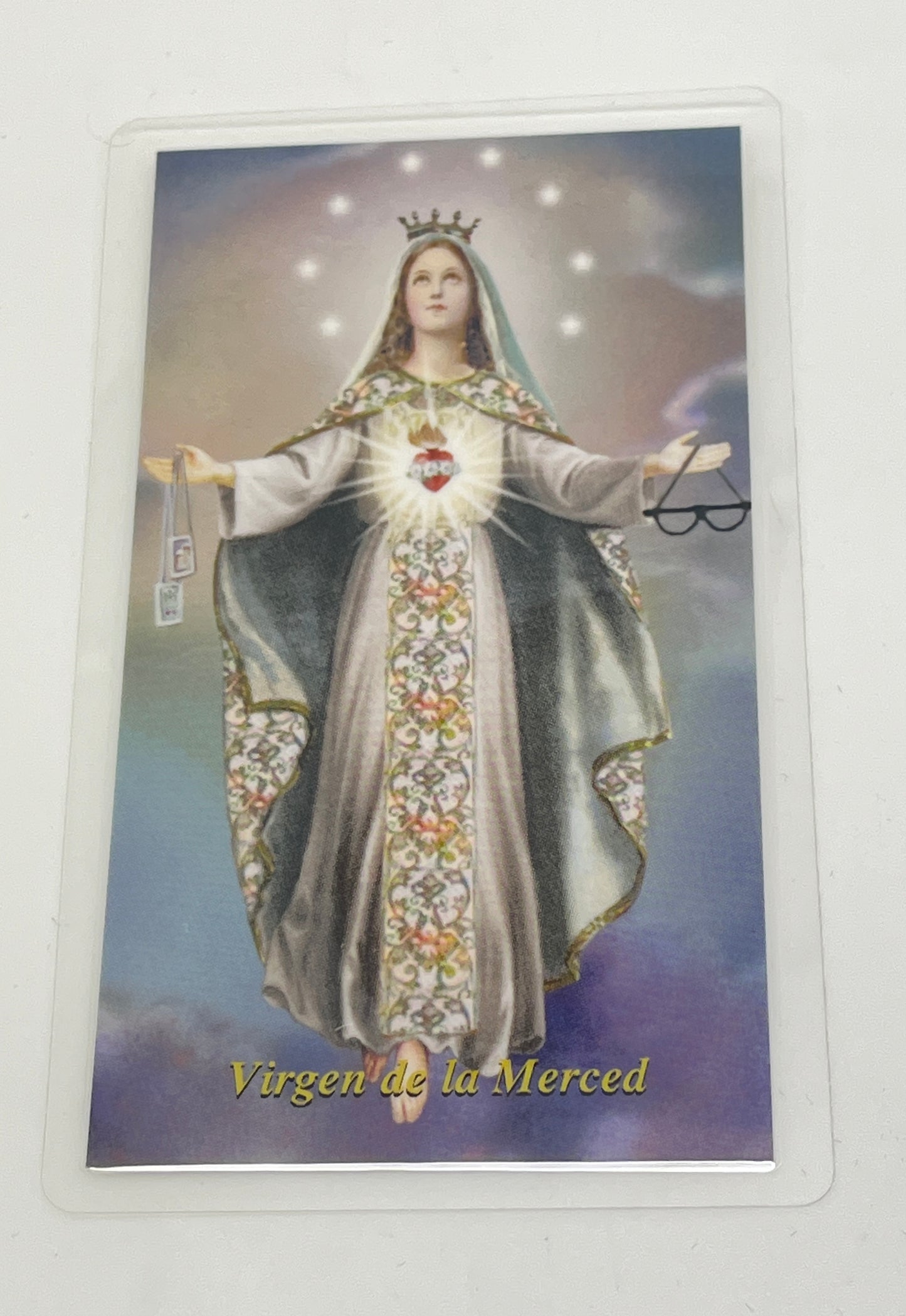 4" x 6" laminated holy card of Virgin de la Merced with detailed sacred heart image and prayer on back