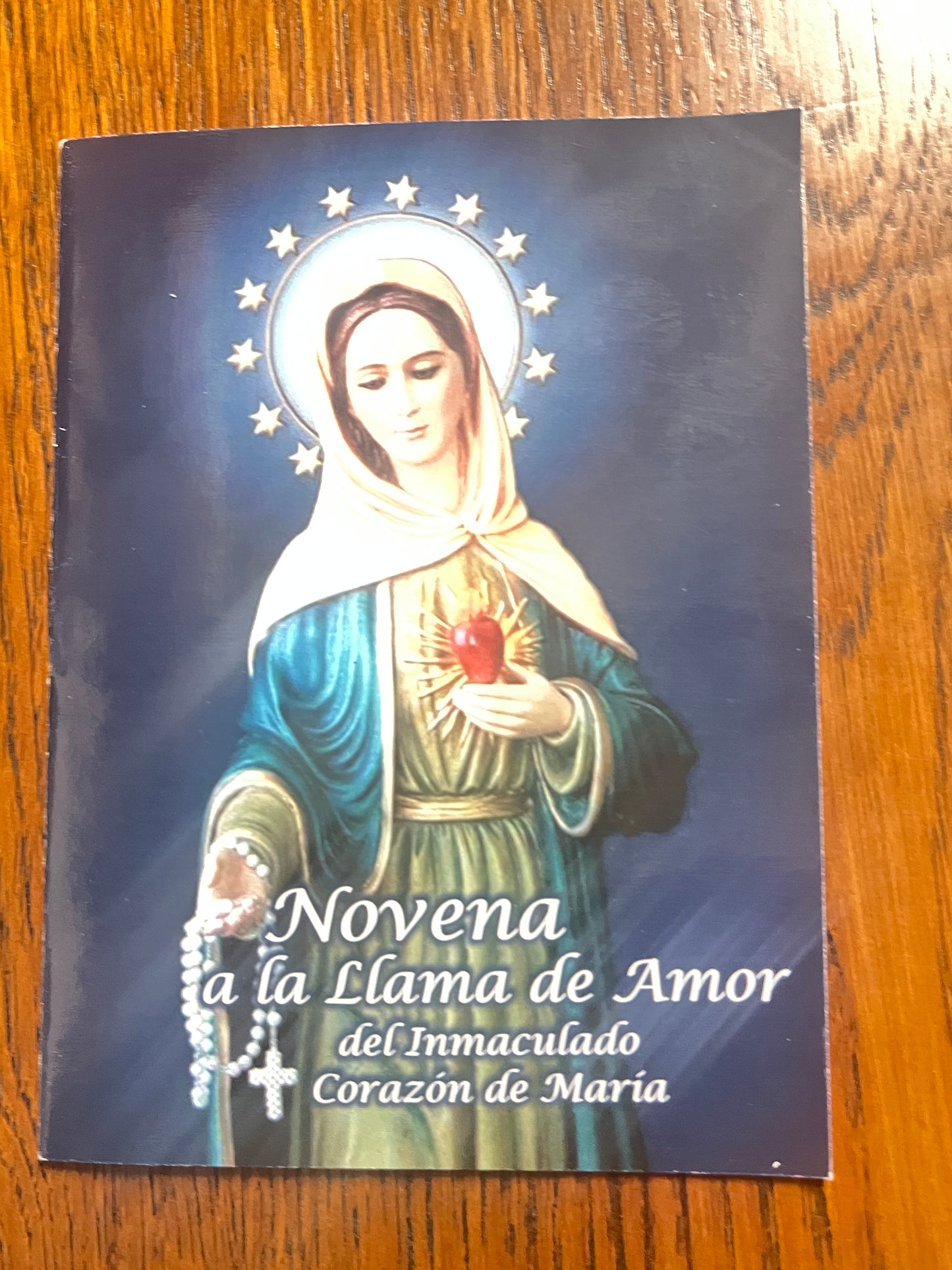 Prayer booklet titled Novena to the Flame of Love of the Immaculate Heart of Mary with devotional image on cover