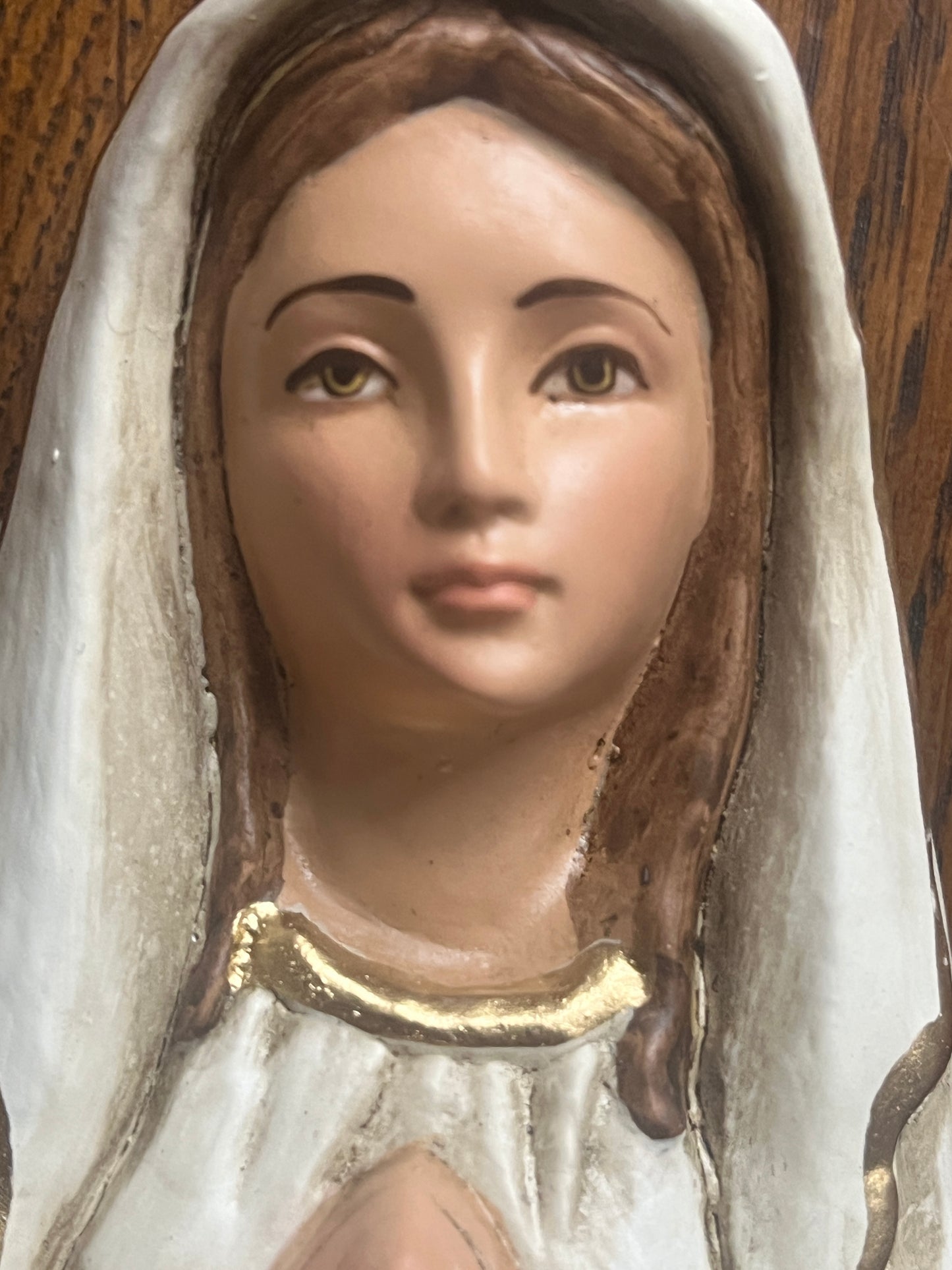 Hand-painted close-up of Rosa Mystica statue head with white veil and gold detailing on holy water font