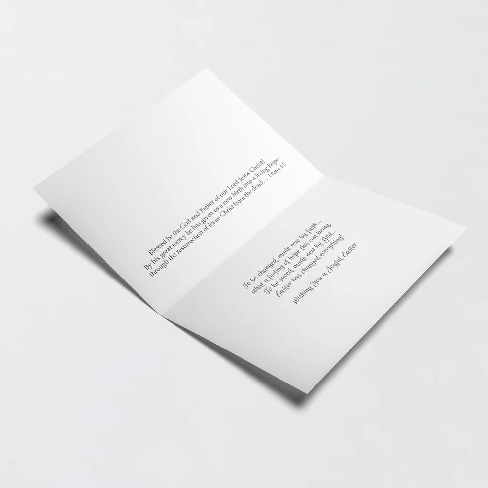 Easter card open showing printed Bible verse and inspirational message about faith and joy of Easter celebration