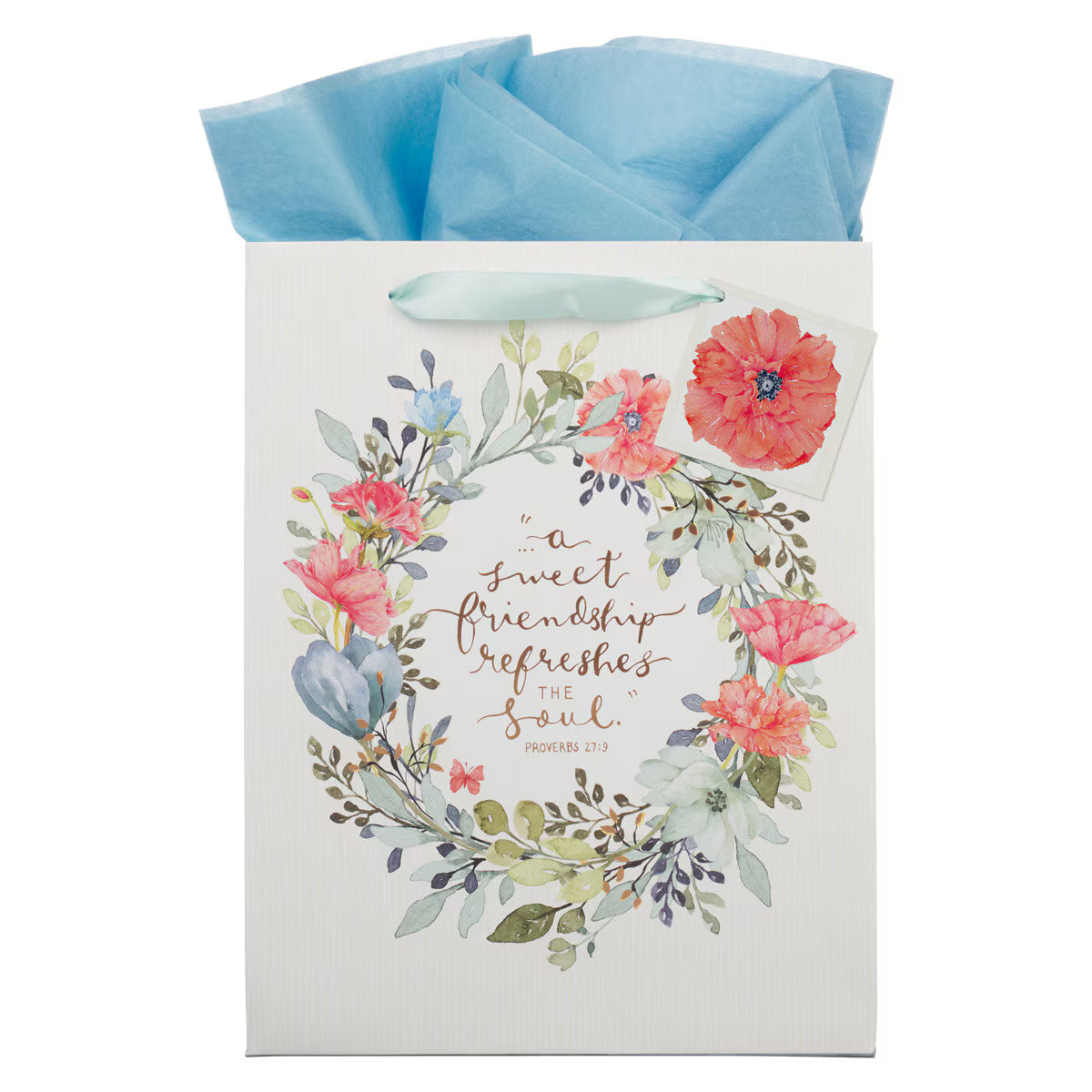 Large portrait gift bag with bright floral wreath and Proverbs 27:9 sweet friendship quote with blue tissue paper