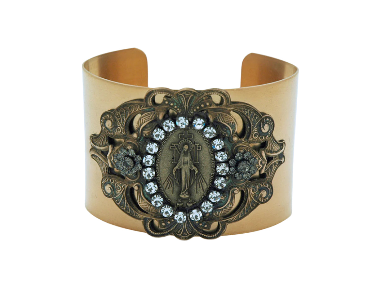 Vintage style cuff bracelet with detailed Miraculous Medal centerpiece and clear Swarovski crystals on antique gold band