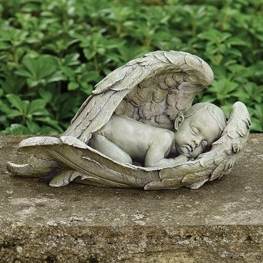 7-inch resin statue of a sleeping baby cradled by detailed angel wings for garden or memorial display