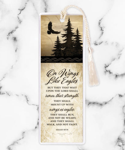 Bookmark with tassel featuring silhouette of eagle and pine trees with Isaiah 40:31 scripture verse on cream background