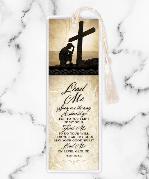 Tassel bookmark with silhouette of kneeling man by cross and Psalm 143:8,10 scripture titled Lead Me verse