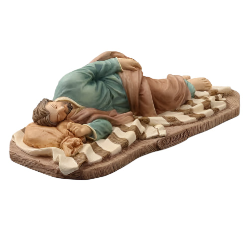 8 3/8" Sleeping St. Joseph statue hand-painted with peaceful expression, lying on striped blanket and wooden base