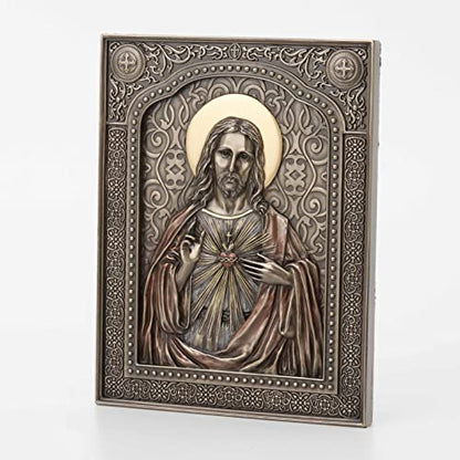 7 1/2" bronze-finished resin wall plaque of the Sacred Heart of Jesus with detailed halo and ornate border design