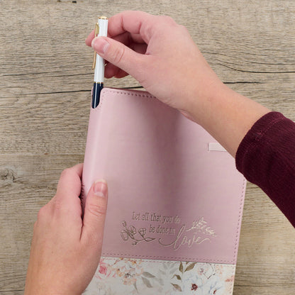 Done in Love pink floral classic journal with elastic closure and pen holder, featuring embossed inspirational quote on cover.