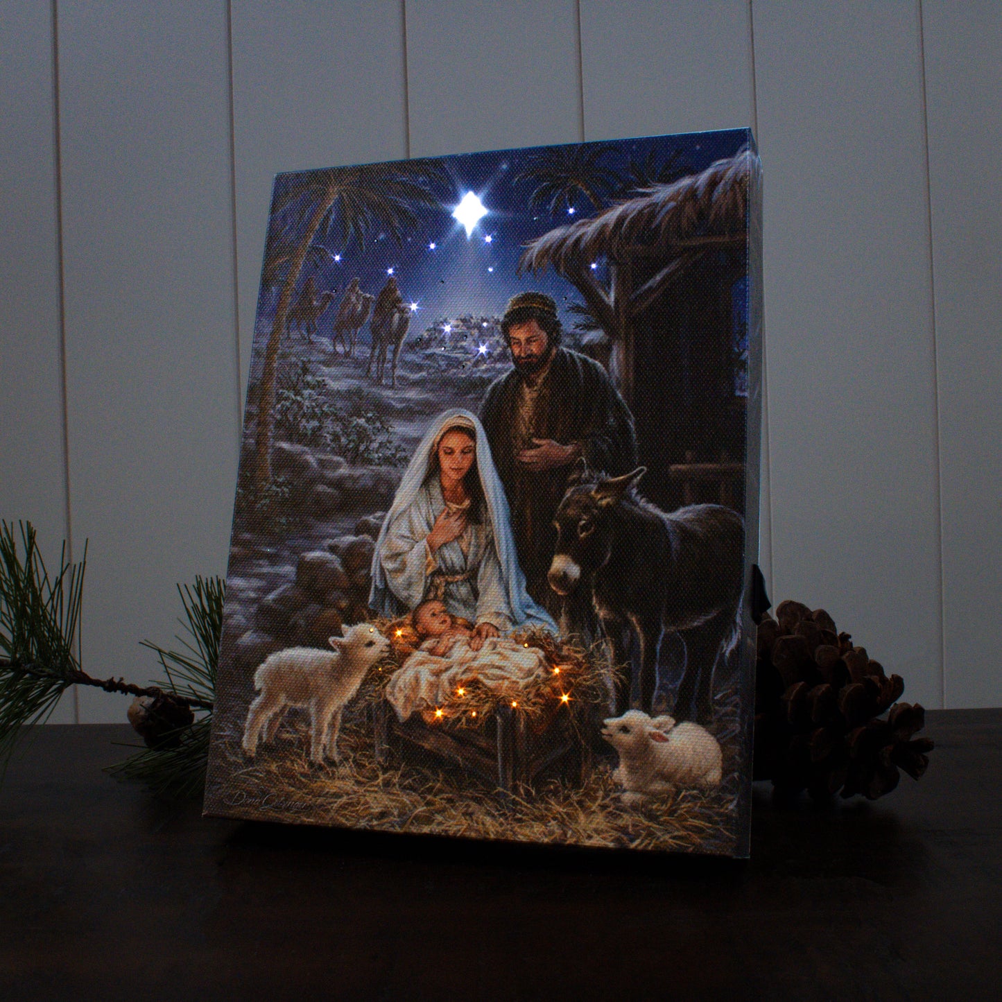 A Savior is Born" 8x6 lighted tabletop canvas depicting nativity scene with Mary, Joseph, baby Jesus, animals, and glowing star.