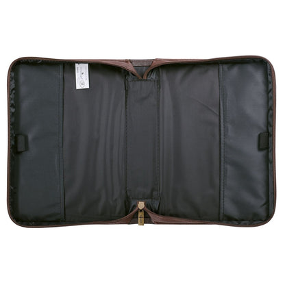Large walnut-brown faux leather Bible cover with black interior, zipper closure, and cross-shaped zipper pull detail