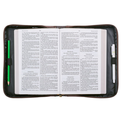 Large open Bible inside walnut-brown faux leather cover with zipper and protective padded edges