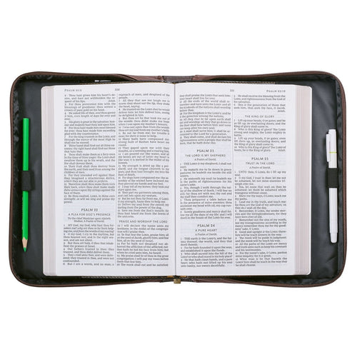 Large open Bible inside walnut-brown faux leather cover with zipper and protective padded edges