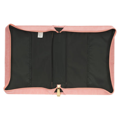 Open rose pink faux leather Bible cover with black interior and gold zipper detail on white background