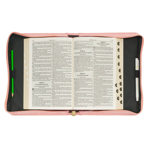 Large indigo rose faux leather Bible cover open flat with Bible pages, pen holder, and green bookmark visible inside
