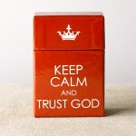 Red box of blessings with white crown icon and "Keep Calm and Trust God" text on front side