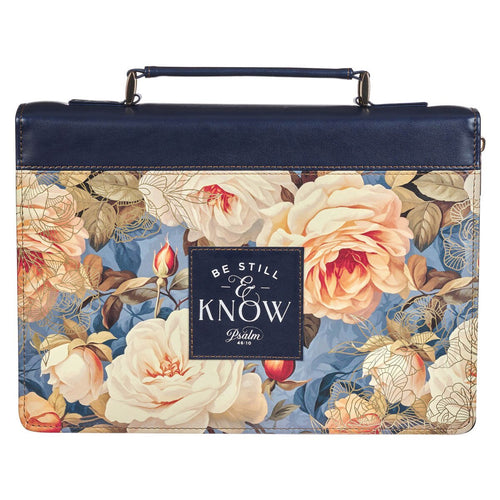 Blue faux leather Bible cover with serene cream and peach roses and stitched "Be Still & Know Psalm 46:10" patch