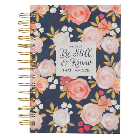 Spiral journal with painted pink and white peonies on navy cover featuring Psalm 46:10 "Be Still & Know" text block
