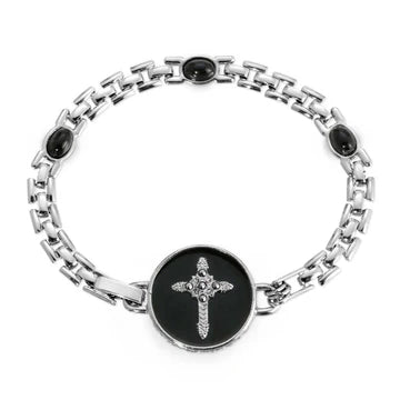 Silver tone brick chain bracelet with oval black stones and black enamel center cross with marcasite accents