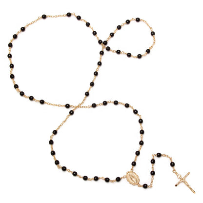 26" yellow gold plated rosary necklace with black beads featuring Our Lady of Guadalupe medallion and crucifix pendant