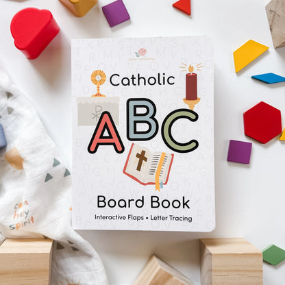 Catholic ABC board book for children featuring interactive flaps, letter tracing, and faith-based illustrations on white background