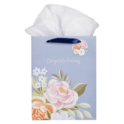 Large portrait gift bag in blue with floral design, "Congratulations" text, navy ribbon handles, and matching gift tag
