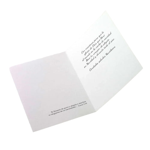Open Christmas card with Spanish prayers and holiday greetings in black script on white background