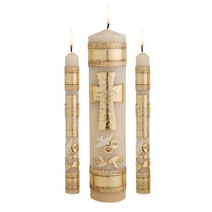 Wedding unity candle set featuring gold embossed cross and rings on ivory wax with flame lit wicks