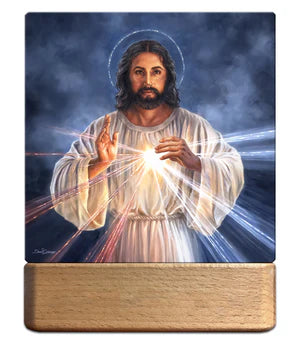 7" Divine Mercy LED night light with illuminated rays, Jesus figure, and wooden base displaying peaceful glow
