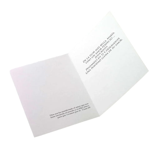 Christmas card titled El Amor Descendio with Spanish religious text and Bible verse inside on white background