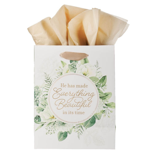 Medium gift bag with green floral wreath design and Ecclesiastes 3:11 quote, beige tissue paper inside