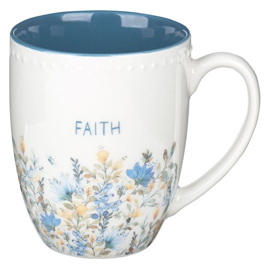 Creamy white Faith mug with blue interior, delicate blue and tan floral design, bluebirds, butterflies, and blue block lettering