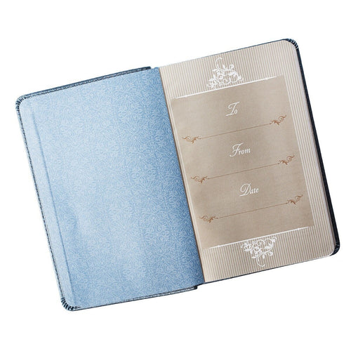 Blue faux leather devotional book for couples open to dedication page with decorative script and patterns