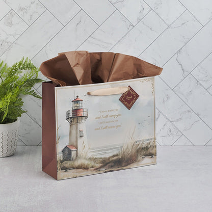 Large landscape gift bag with lighthouse design, Isaiah 46:4 scripture, and brown tissue paper inside