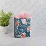 Medium teal gift bag with colorful floral design and "The Lord Bless You" Bible verse Numbers 6:24 on front