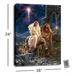 18" x 24" illuminated canvas print depicting the nativity journey with Mary, Joseph, and bright star at night