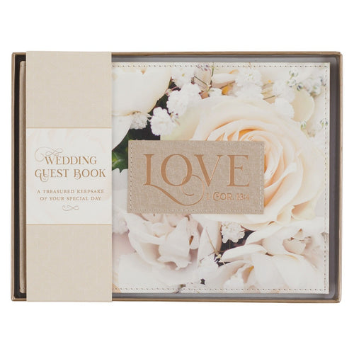 Medium guest book with ivory faux leather cover, floral design, and stitched LOVE patch for weddings