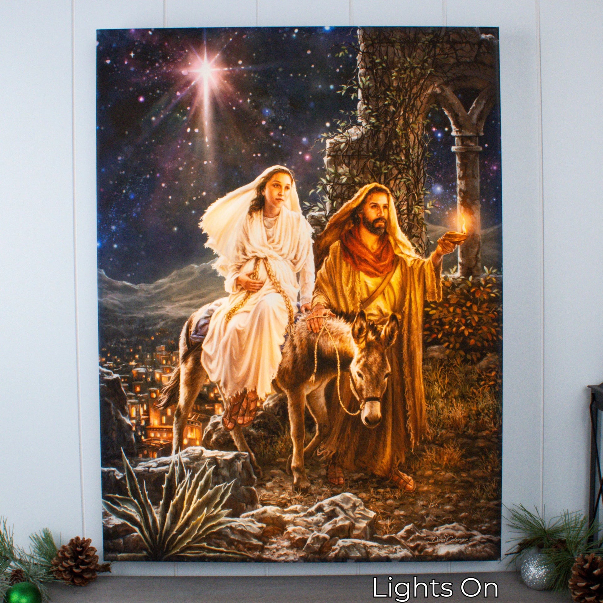 Illuminated canvas print of Mary and Joseph’s journey to Bethlehem with bright star and warm glowing light