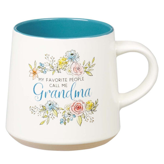 Ceramic Grandma coffee mug with floral design, blue interior, and beige clay dipped base on white background