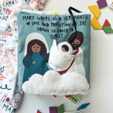 Soft fabric children's quiet book titled Wrapped in Mary’s Mantle with plush dog and colorful felt illustrations