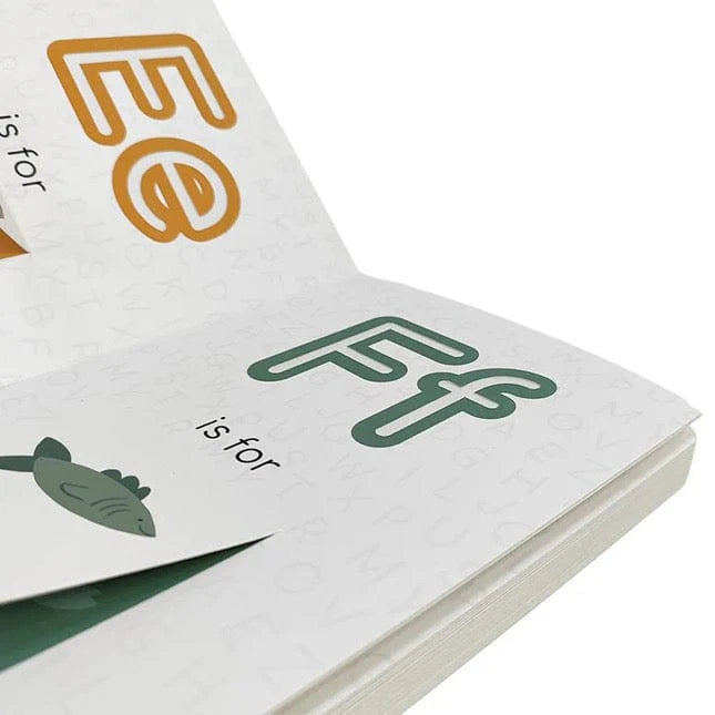 Open pages of Catholic ABC Board Book showing letters E and F with simple illustrations and text on white background